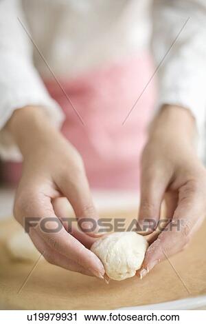 Human hand of young woman kneading dough View Large Photo Image Stock Image - Human hand of young woman kneading dough. Fotosearch