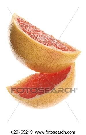 Two pieces of grapefruit View Large Photo Image Stock Photo - Two pieces of grapefruit. Fotosearch