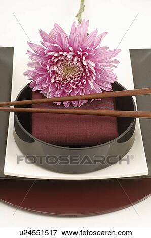 Stock Photo - Asian place setting with a blossom. Fotosearch