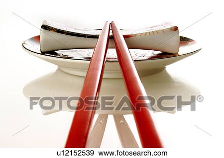 Asian plate with red chopsticks View Large Photo Image Stock Photo - Asian plate with red chopsticks. Fotosearch