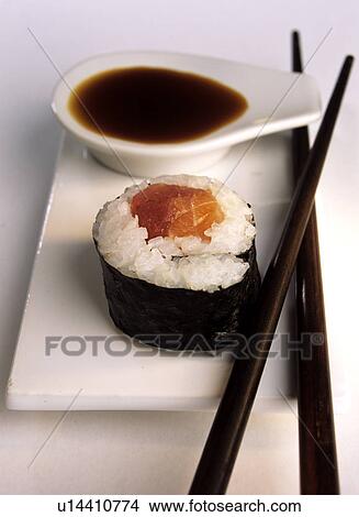 Maki sushi with salmon, soy sauce and chopsticks View Large Photo Image Picture - Maki sushi with salmon, soy sauce and chopsticks. Fotosearch