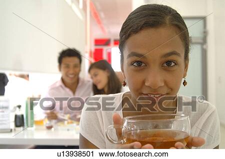 Woman with a cup of tea View Large Photo Image Stock Image - Woman with a cup of tea. Fotosearch