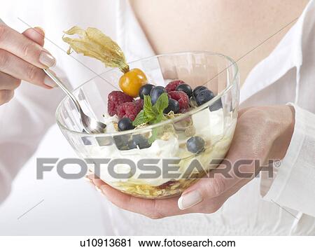 Stock Image - Cereals with berries and quark. Fotosearch