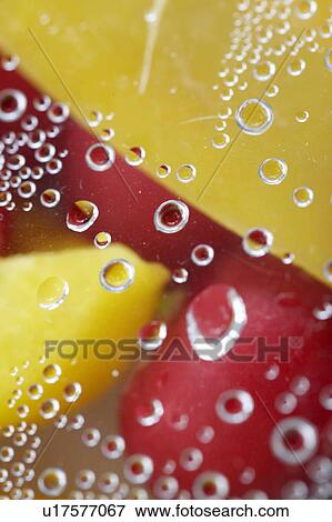 Stock Photo - Paprika and radish close up with water drops. Fotosearch