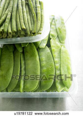 Stock Image - Peasecods and green beans. Fotosearch