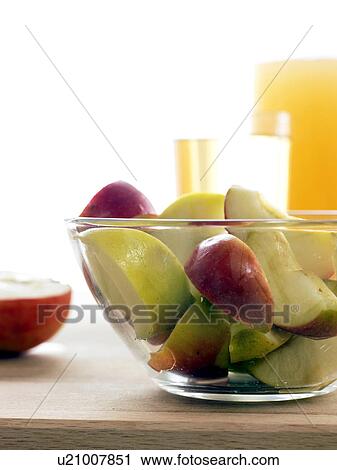 Pieces of Gloster apples in a glass bowl View Large Photo Image Stock Image - Pieces of Gloster apples in a glass bowl. Fotosearch