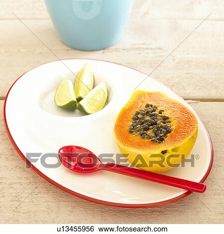 Sliced papaya and limes View Large Photo Image Stock Photograph - Sliced papaya and limes. Fotosearch