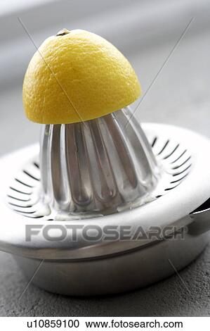 Squeezer with lemon View Large Photo Image Stock Image - Squeezer with lemon. Fotosearch