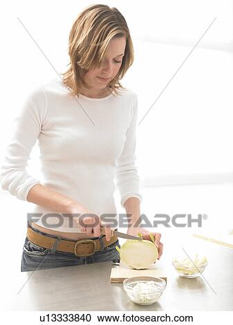 Stock Image - Woman eating ice lolly. Fotosearch
