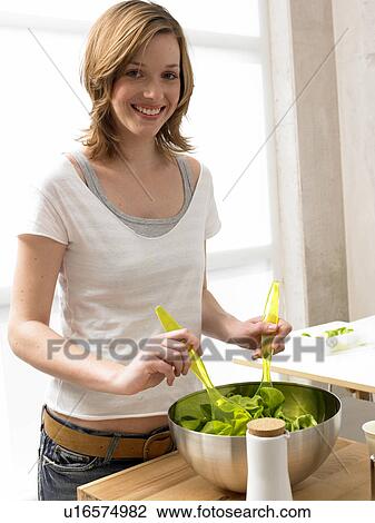Woman preparing salad View Large Photo Image Stock Image - Woman preparing salad. Fotosearch