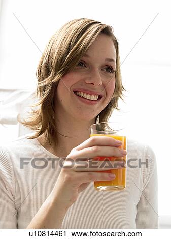 Woman with a glass of juice View Large Photo Image Stock Image - Woman with a glass of juice. Fotosearch