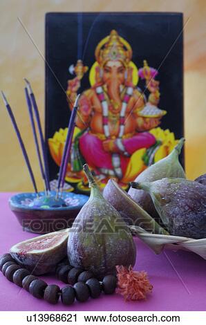 Stock Image - Figs and joss sticks. Fotosearch