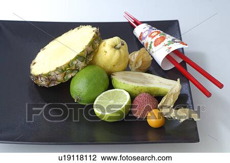 Fruits on a plate with chopsticks View Large Photo Image Stock Image - Fruits on a plate with chopsticks. Fotosearch