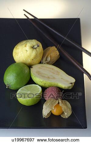 Fruits on a plate with chopsticks View Large Photo Image Stock Photo - Fruits on a plate with chopsticks. Fotosearch