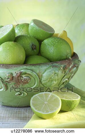 Lemons and limes in a bowl View Large Photo Image Stock Photograph - Lemons and limes in a bowl. Fotosearch