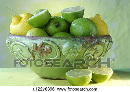 Lemons and limes in a bowl View Large Photo Image Stock Photograph - Lemons and limes in a bowl. Fotosearch
