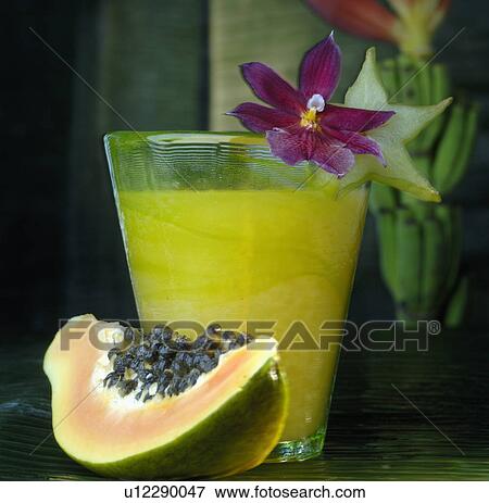 Papaya and a glass of juice View Large Photo Image Stock Photo - Papaya and a glass of juice. Fotosearch