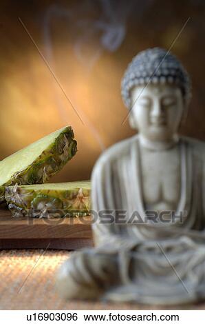 Stock Photograph - Pineapple and Buddha. Fotosearch