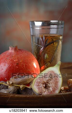 Pomegranate, date and fig View Large Photo Image Stock Image - Pomegranate, date and fig. Fotosearch