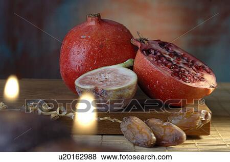Pomegranate, date and fig View Large Photo Image Stock Photo - Pomegranate, date and fig. Fotosearch