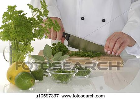 Stock Photo - cutting herbage, lemons, knife. Fotosearch