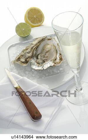 Picture - Oysters and a champagne glass. Fotosearch