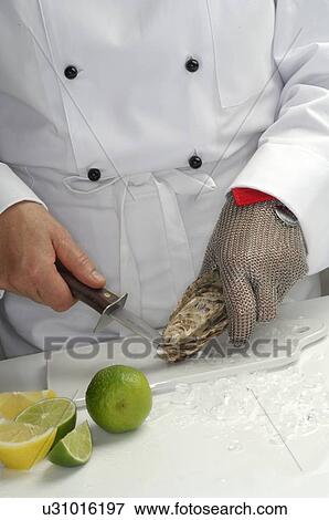 Stock Photo - Preparation of oysters. Fotosearch