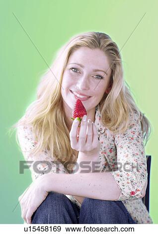 Blonde woman with strawberries View Large Photo Image Stock Photo - Blonde woman with strawberries. Fotosearch