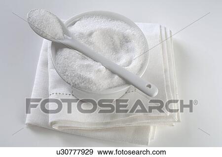 Stock Photo - Bowl filled with sugar. Fotosearch