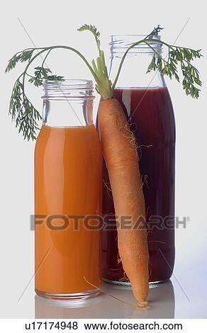 Carrot juice and tomato juice View Large Photo Image Stock Photo - Carrot juice and tomato juice. Fotosearch
