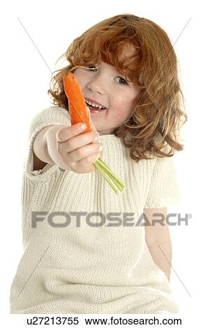 Stock Photography - Little girl with a carrot. Fotosearch