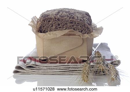 Stock Photo - Organic bread and rye ears. Fotosearch