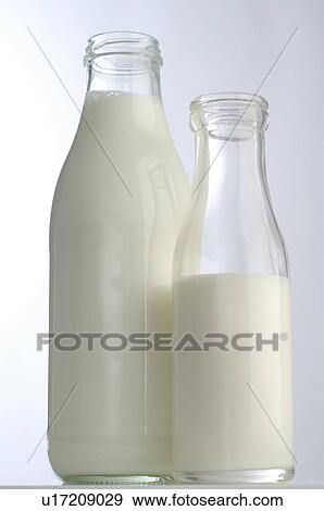 Stock Photo - Organic milk in bottles. Fotosearch