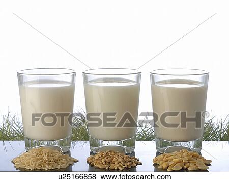 Three glasses of milk and different kinds of grain View Large Photo Image Stock Photo - Three glasses of milk and different kinds of grain. Fotosearch