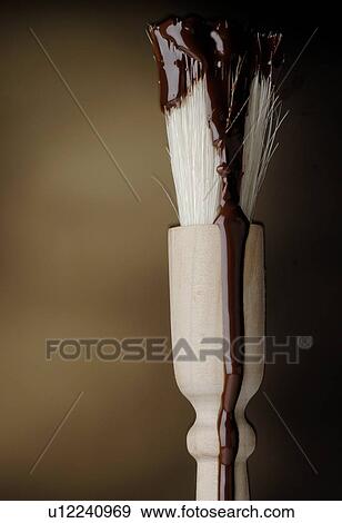 Brush with melted chocolate View Large Photo Image Stock Photo - Brush with melted chocolate. Fotosearch