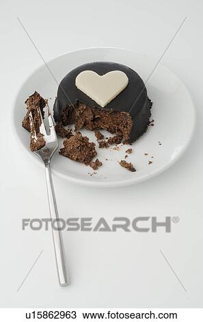 Stock Image - Chocolate cake with a marzipan heart. Fotosearch