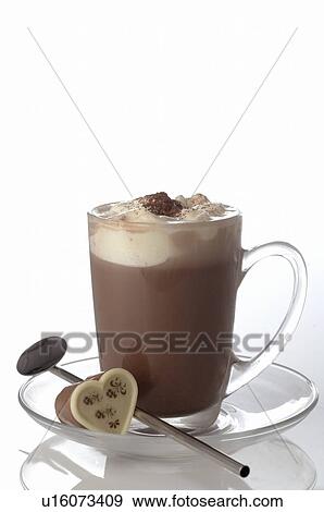 Stock Photo - Chocolate in a glass cup and a heartshape piece of chocolate. Fotosearch