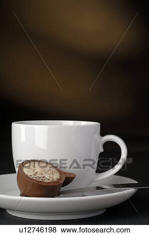 Stock Photo - Cup and a piece of chocolate. Fotosearch