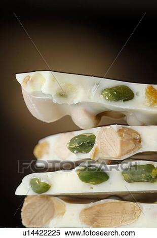 Stock Photography - White chocolate with nut and pistachio. Fotosearch