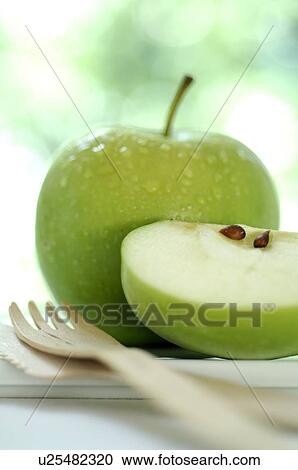 Apple and a wooden fork View Large Photo Image Stock Image - Apple and a wooden fork. Fotosearch