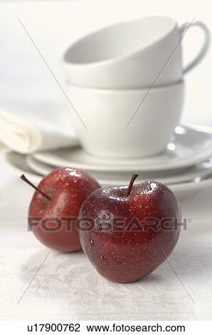 Stock Image - Apples and cups. Fotosearch