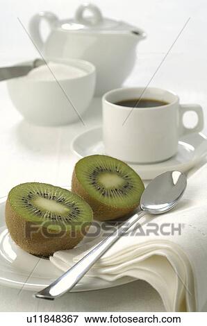 Breakfast place setting with kiwi fruit View Large Photo Image Stock Photo - Breakfast place setting with kiwi fruit. Fotosearch