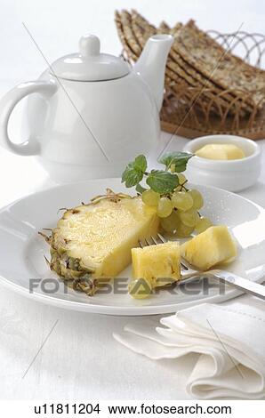 Breakfast place setting with pineapple View Large Photo Image Picture - Breakfast place setting with pineapple. Fotosearch