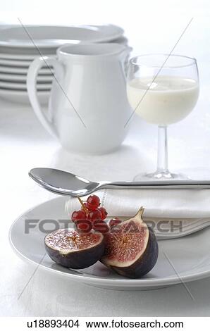 Picture - Fig and red currant on a plate. Fotosearch