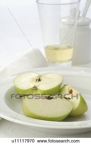 Sliced apple on a plate View Large Photo Image Stock Image - Sliced apple on a plate. Fotosearch