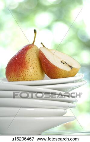 Stack of plates and pear View Large Photo Image Stock Photo - Stack of plates and pear. Fotosearch