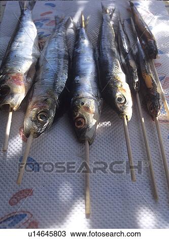 Stock Image - Aufgespießte Sardinen. Fotosearch