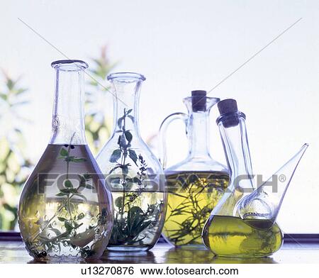 Ölflaschen mit Kräutern View Large Photo Image Stock Photograph - Ölflaschen mit Kräutern. Fotosearch