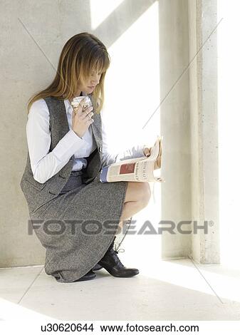 Business woman holding a cup of coffee View Large Photo Image Picture - Business woman holding a cup of coffee. Fotosearch
