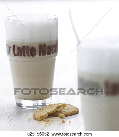 Stock Image - Latte macchiato and a cookie. Fotosearch